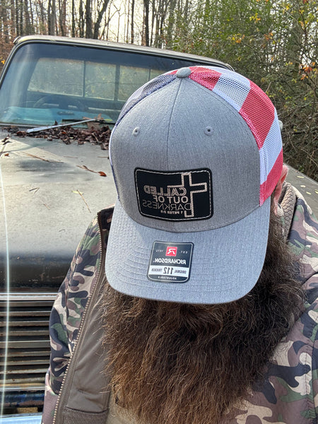 Called out of darkness black and silver patch with light gray and American 🇺🇸 flag back Richardson 112 trucker